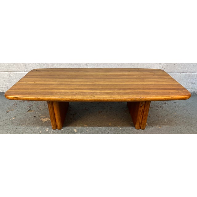 This vintage mid-century modern solid oak coffee table features a butcher-block striped top with distinctive rounded...