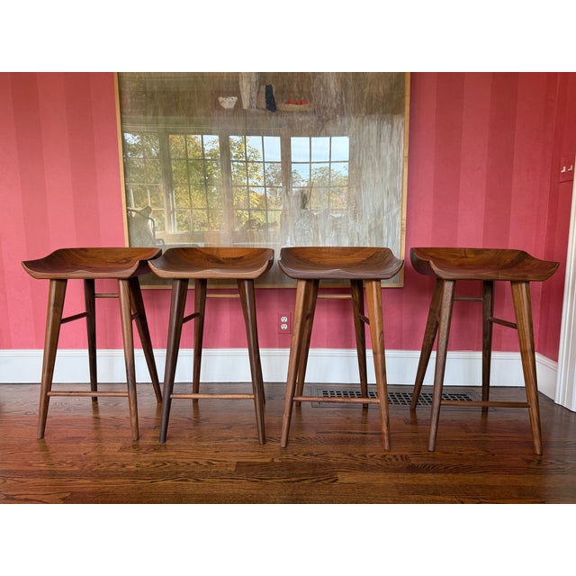 Set of 4 Exceptionally Made Walnut Counter Stools. These solid, sturdy, and beautifully molded counter stools are as...