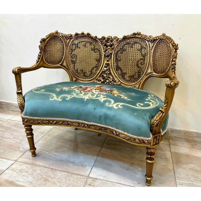 Add a refined touch of French elegance to your interior with this charming French Louis XV-style settee, featuring an...