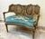 Add a refined touch of French elegance to your interior with this charming French Louis XV-style settee, featuring an...