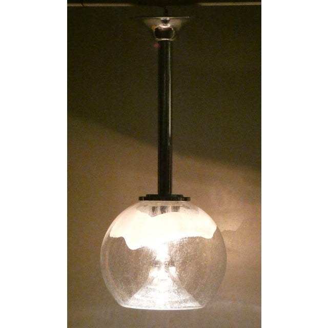 Telescopic rigid stem suspension in final toulipe. Production in murano glass produced by mazzega and design attributable...