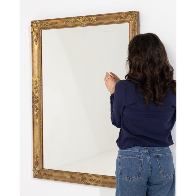 A second 19th century French wall mirror in the Empire style, maintaining a structured frame and proportion-driven design....
