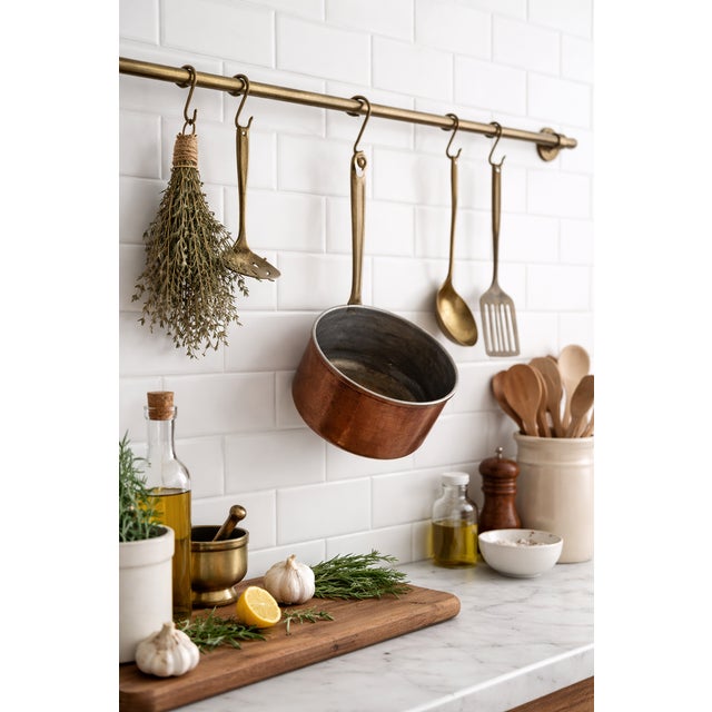 Beautiful vintage copper saucepan from Portugal, crafted in solid copper with a brass handle and a rolled lip at the rim....