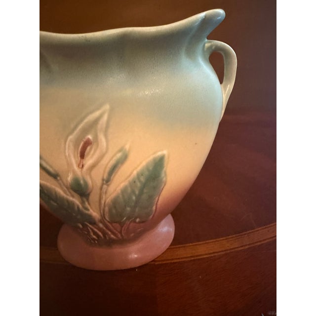 he Hull Art Pottery Calla Lily Vase #530/33 is a vintage double handle pillow vase handmade in North America in 1938. The...