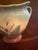 he Hull Art Pottery Calla Lily Vase #530/33 is a vintage double handle pillow vase handmade in North America in 1938. The...