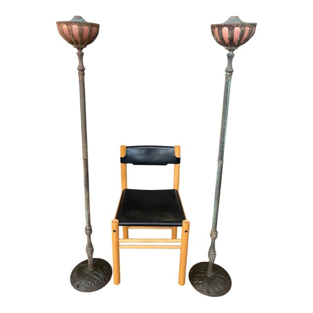 Striking pair of Antique tall garden torchiere oil lamps crafted from cast iron, heavy cast metal, and copper. These...