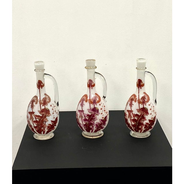 A remarkable decanter in milk-soapy opal glass, crafted by the esteemed Legras et Cie. Featuring a graceful handle and an...