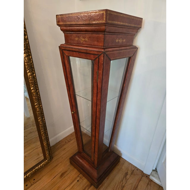 A very rare vintage original superb quality leather bound pedestal in the style of Jaques Adnet . Having tight and...