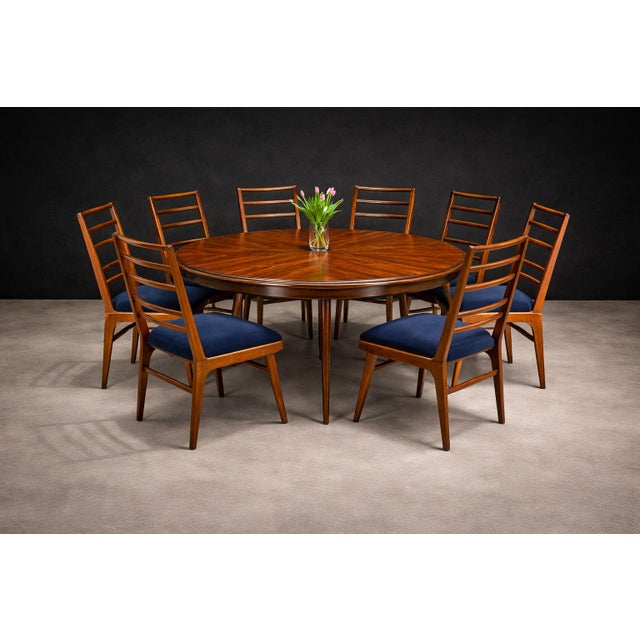 This set of eight dining chairs reflects the disciplined craftsmanship and structural clarity characteristic of Brazilian...