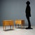 Pair of vintage wooden bedside tables with two drawers. This piece is attributed to the mentioned designer/maker. It has...
