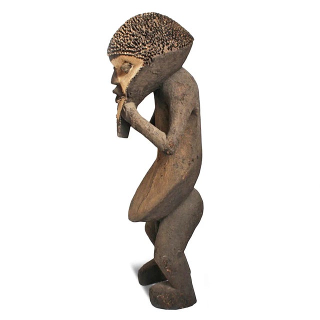 Original vintage wood carved statue from Cameroon Suaga Association which is concerned with justice and protection from...
