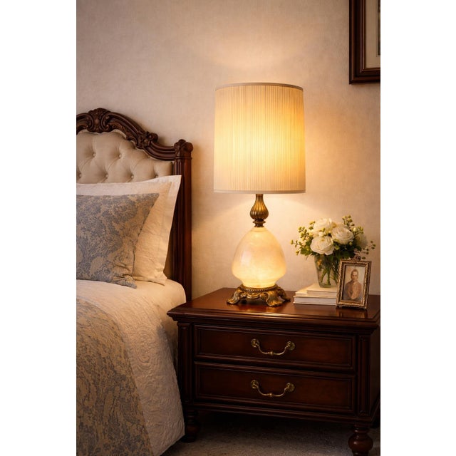 Substantial 35” Hollywood Regency alabaster and heavy cast brass table lamps featuring illuminated alabaster bases with...