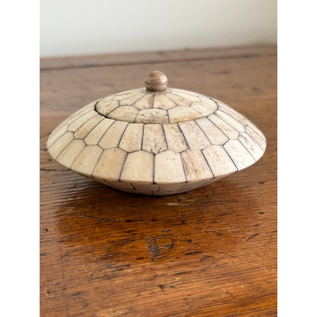 A sleek and highly distinctive Maitland-Smith vintage tessellated bone trinket box featuring an organic, low-profile...