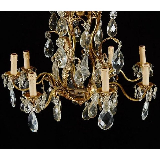 Chandelier in Brass with Eight Candleholders, in Good conditions. Designed 1920 to 1949 Up to 250V (Europe/UK...