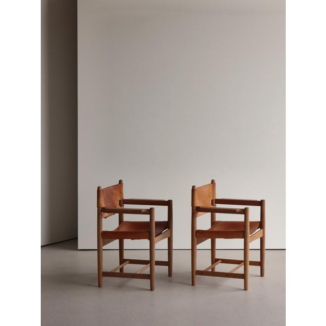 Beautiful pair of vintage "BM 3238" arm chairs in oak and natural saddle leather. Designed in the 1950s by Borge Mogensen...