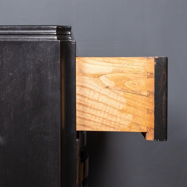 Striking 20th Century Italian ebonised chest of four pull-out drawers with a lit up vitrine display top and carved buckle...