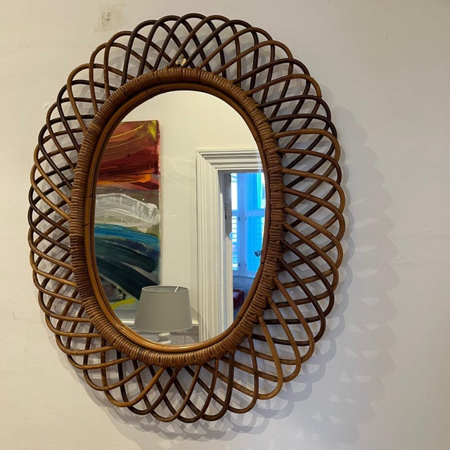 Mid-Century Modern Italian Oval Rattan and Bamboo Mirror attributed to Franco Albini, in Flawless conditions. Designed...