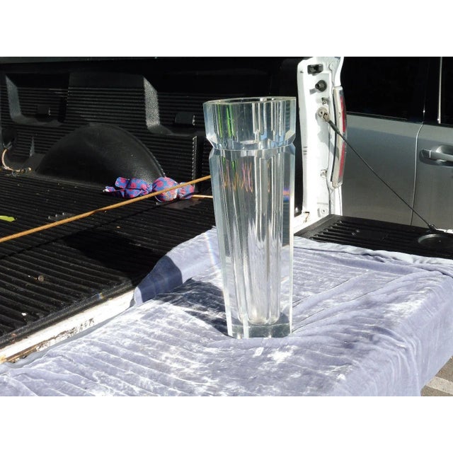 This is a vintage 1970s thick towering Lucite vase. The piece is unsigned.