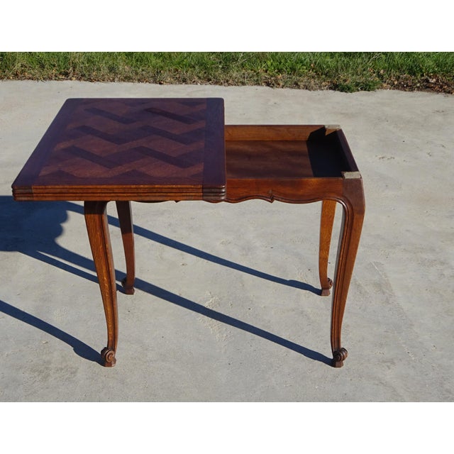 Modular folding table, the tabletop pivots and unfolds to double its surface area. Made in France using traditional...