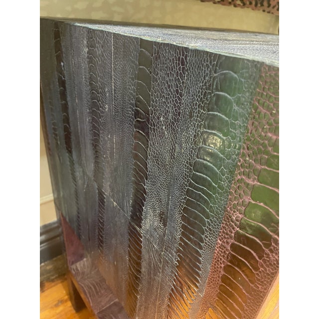 Most unusual and beautiful embossed leather nightstand. In both blue and purple, this vintage piece makes the room