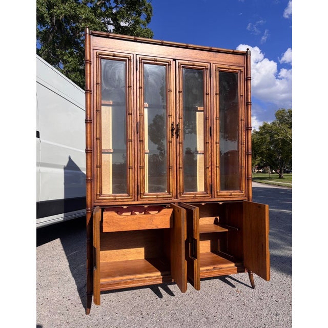 This classic Stanley faux bamboo hutch blends seamlessly with an array of styles, from Mid Century to Coastal to Hollywood...