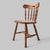 A character-rich oak side chair by Ethan Allen, pairing a sculpted crest rail with a graceful spindle back, shaped seat,...