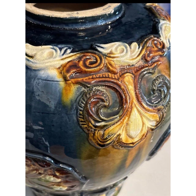This antique Cobalt Blue Sancai Glaze Style Urn Vase is a stunning piece of majolica pottery, standing at 11" high and 10"...