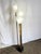 An elegant Art Deco torchiere floor lamp featuring sculptural frosted acrylic shades inspired by calla lily forms. The...