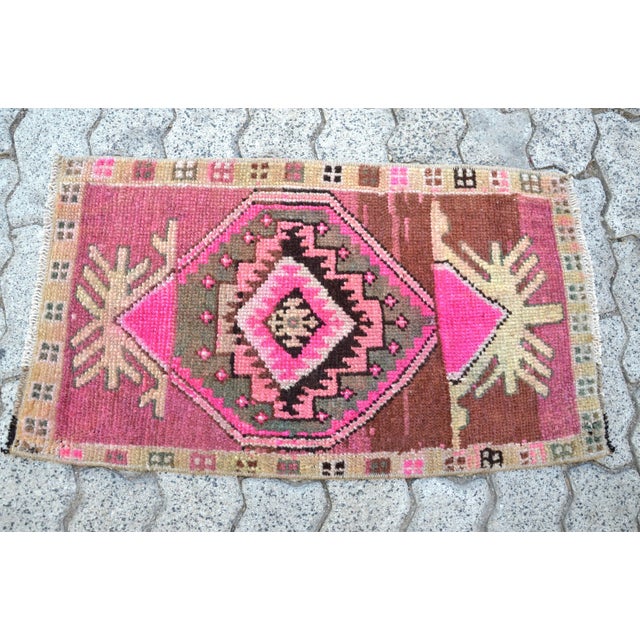 This is a vintage Turkish Oushak rug from the 1960s. The piece was hand-knotted.