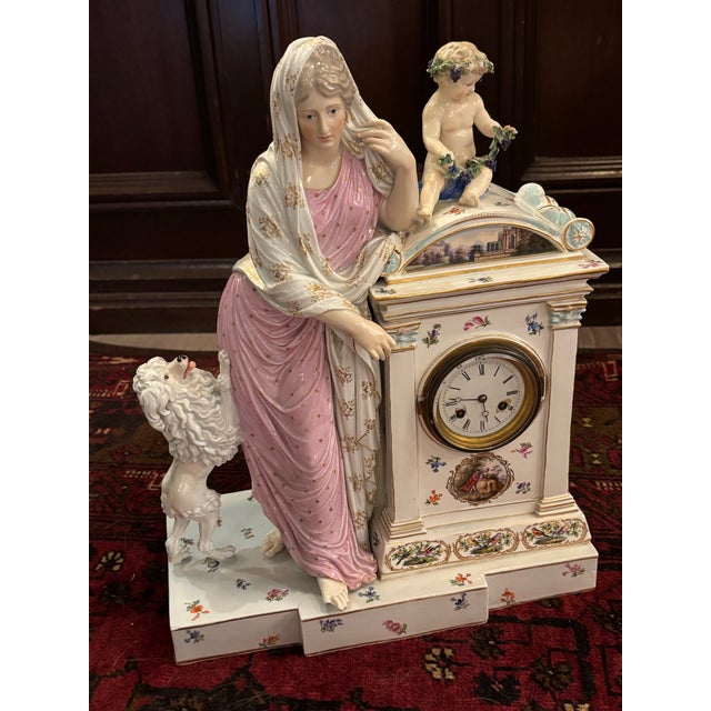 An extraordinary Meissen porcelain figural mantel clock, dating to the mid-19th century and bearing the blue underglaze...