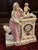 An extraordinary Meissen porcelain figural mantel clock, dating to the mid-19th century and bearing the blue underglaze...