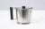 Georg Jensen serving set including a stainless steel knife and forks, together with a pair of Gense stainless steel...