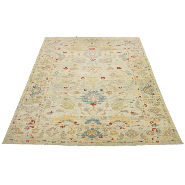 This is a beautiful contemporary Sultanabad oversized rug, handcrafted using knotted wool. It features a light blue and...