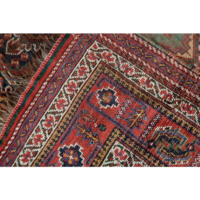 Handmade antique oversized Persian Khamseh rug in traditional design. The rug is from the end of 19th century in...