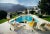 Catch Up By The Pool 1970 by Slim Aarons Slim Aarons Limited Estate Edition Former fashion model Helen Dzo Dzo Kaptur (in...
