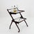 Vintage 1950s Italian Bar Cart designed by Cesare Lacca. Crafted in stained walnut with brass accents, it features two...
