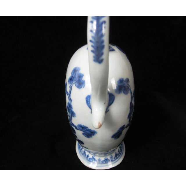 An extraordinarily finely-painted sauce boat with scrolling handle made for the American market 1790-1810. Deep cobalt...