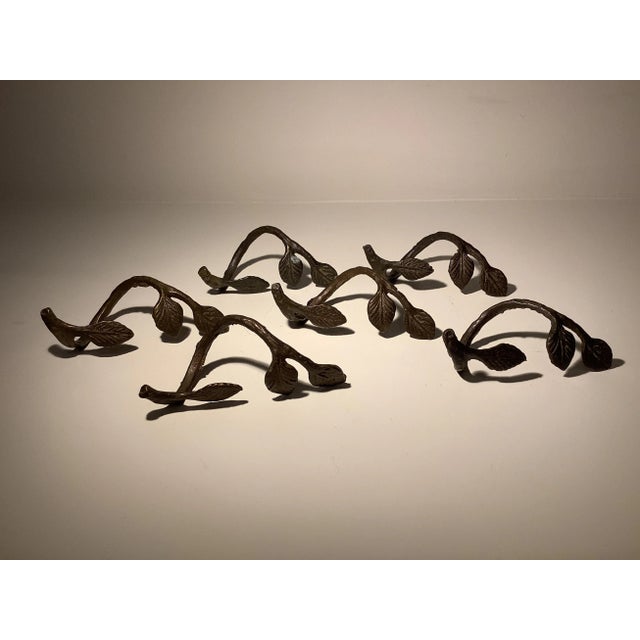 Bronze Leaf Napkin Rings - Set of 6. Unmarked. Each measures roughly 4” x 1.5” x 1.75”.