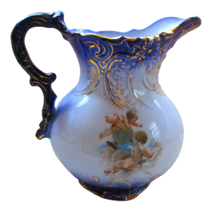 Antique LaBelle China Embosed Flow Blue Cherub Design Milk Pitcher with Gold Trim