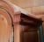 A striking Spanish Baroque revival armoire crafted by Romweber Furniture of Batesville, Indiana. Features an arched bonnet...
