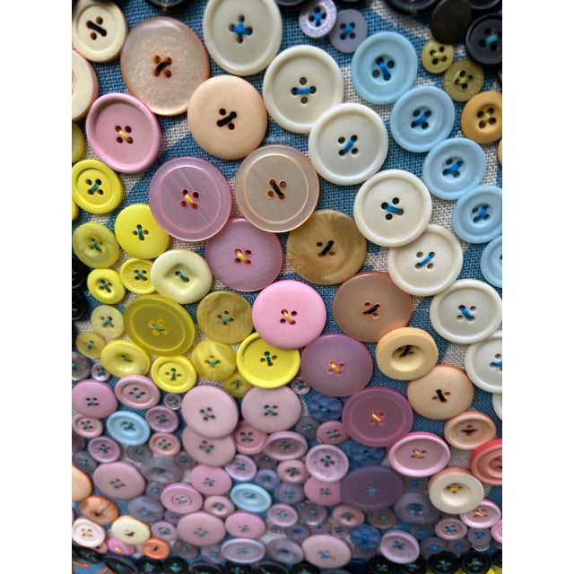 Life Begins with a Swim” is embroidered on this whimsical fabric and button adorned art of a big fish by Maine self taught...