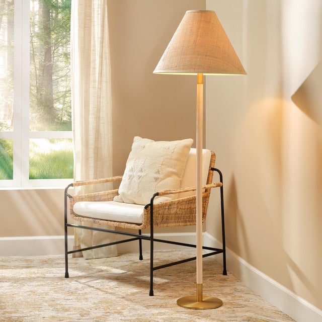 A medley of modern materials, this floor lamp pairs wood with metal and natural fibers for a look that manages to be both...