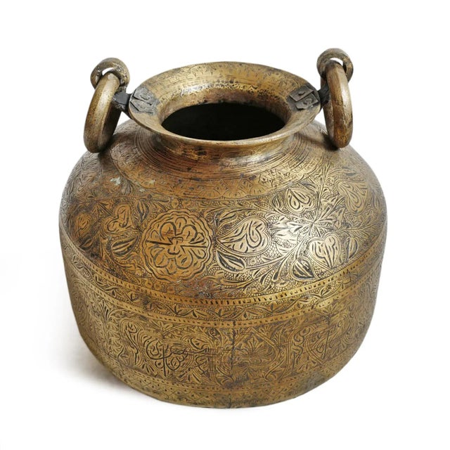 Antique brass water vessel from North India. Amazing intricate original hand etched designs. Opening at top is 6.5" diameter.