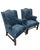 This elegant pair of wingback armchairs has been newly upholstered. The patterned cut velvet on the seat, arms, and...