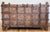 Monumental antique Anglo-Indian Damchiya, or dowry chest. Stunning carved Burmese teak with hand forged iron strap work,...