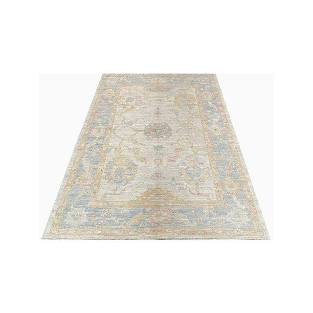 Experience the elegance of the 4x6 Turkish Oushak Area Rug, a unique piece that brings traditional beauty to your home....