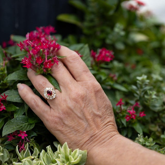 Adorn yourself with the 18k Ruby Ring, featuring a 1.09 carat fine Thai ruby and 1.14 carats of sparkling round and...