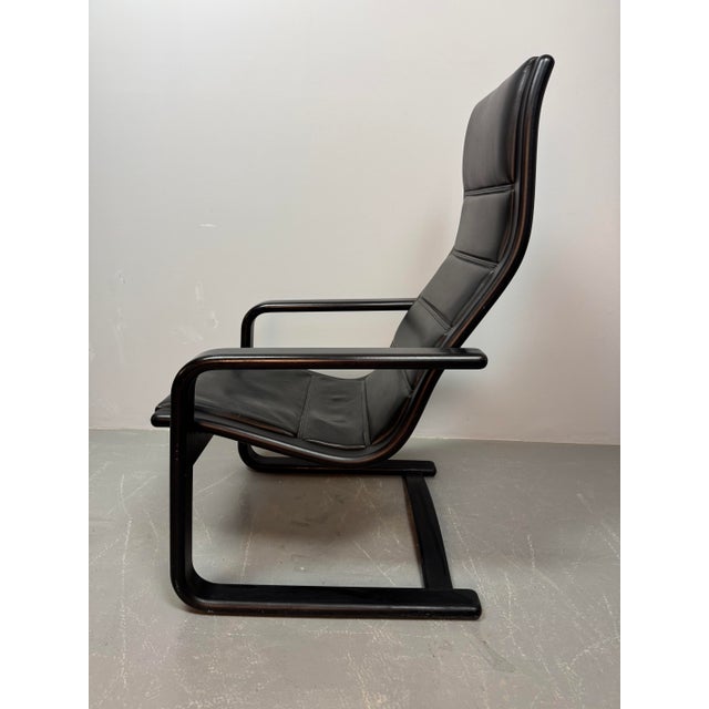Original Lamino lounge chair by Yngve Ekström. Originally designed in 1956 for Swedese. Executed with a black laminated...