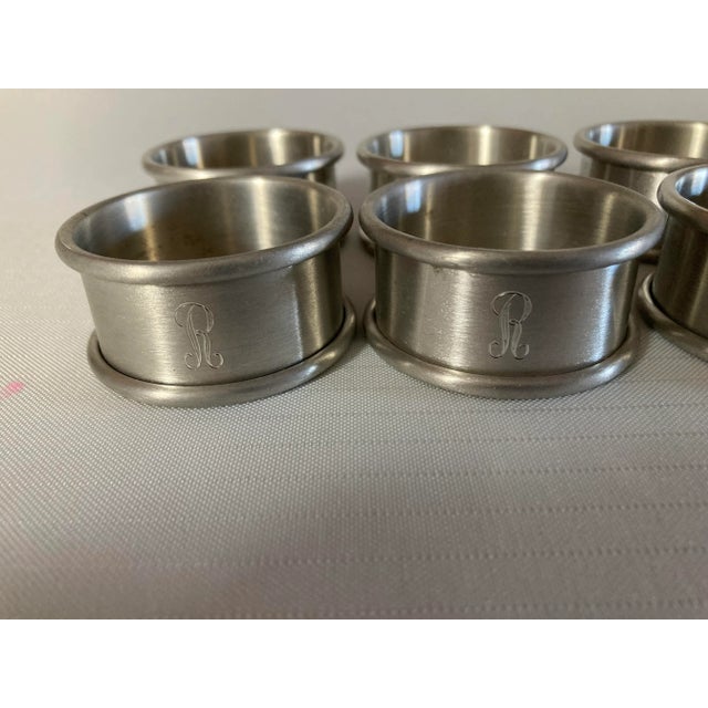 Vintage set of 8 stainless monogram "R" napkin rings 2"R X 1"H no makers mark, in excellent condition.