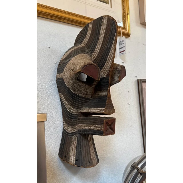 Design Plus Gallery presents an Antique African Senufo Bust. Admire a vintage hand-carved masterpiece that celebrates the...